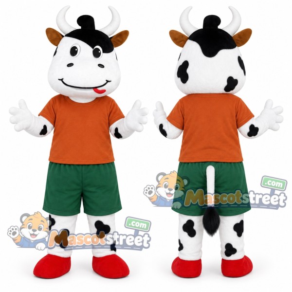 Black and White Cow Mascot Costume with Orange Shirt and Green Shorts