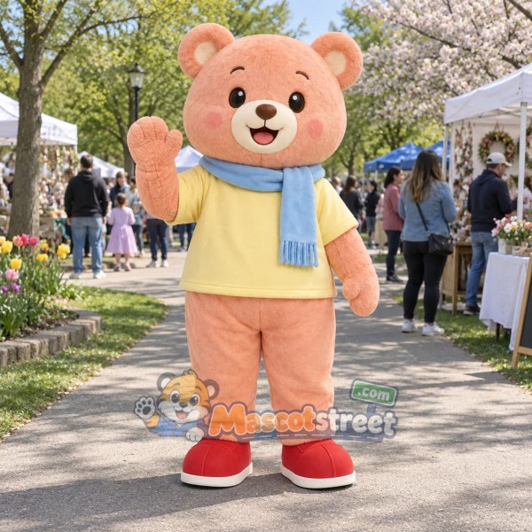 Peach Bear Mascot Costume with Yellow Shirt and Blue Scarf